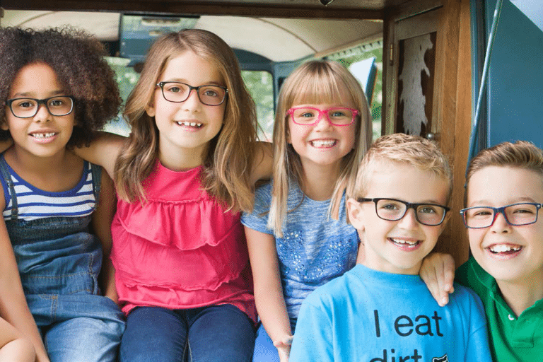 Children's eyecare - group of happy children all wearing glasses