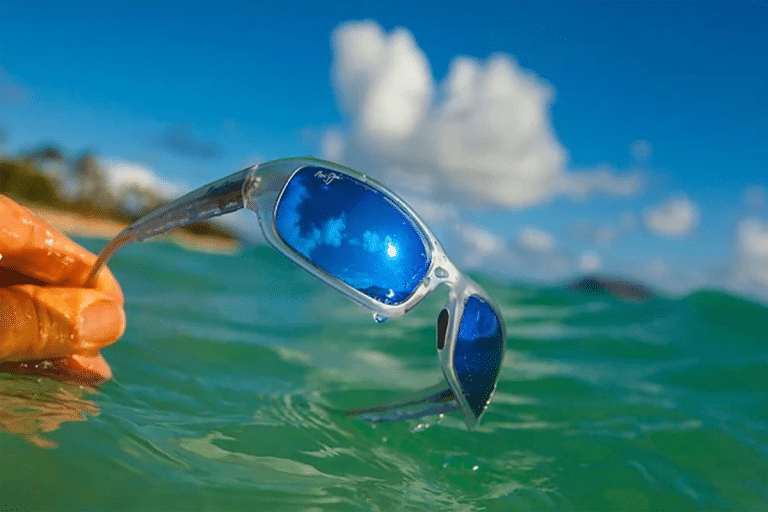 Sports sunglasses - sunglasses with blue lenses over water